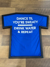 Load image into Gallery viewer, TheGuyWhoDancesOnCongress Trefoil TGWDOC Logo Tee (White Ink on Blue Shirt)