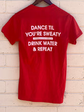 Load image into Gallery viewer, TheGuyWhoDancesOnCongress Trefoil TGWDOC Logo Tee (White Ink on Red Shirt)